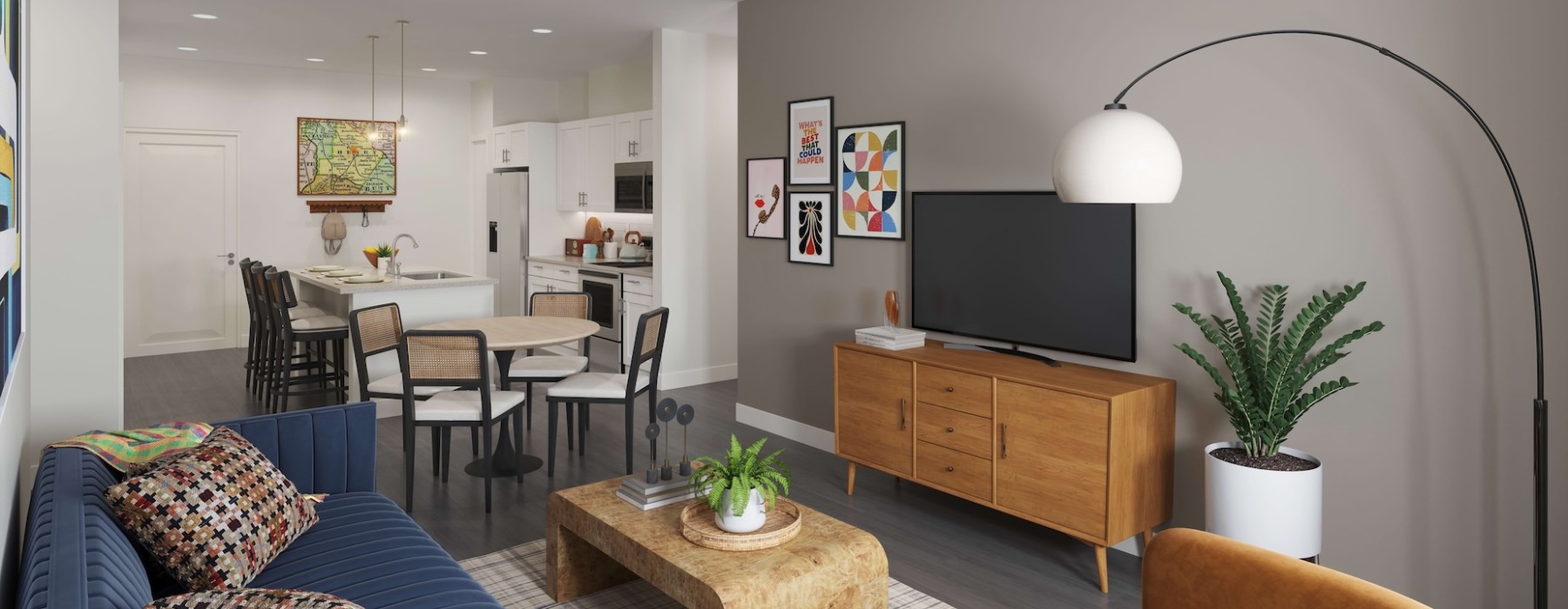 Open living room, dining area, and kitchen at The Weldon by Broadstone apartments in McDonough, GA